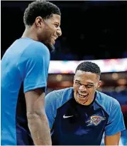  ?? [PHOTO BY SARAH PHIPPS, THE OKLAHOMAN] ?? Oklahoma City’s Russell Westbrook, right, and Paul George share a laugh during Tuesday’s exhibition game against Milwaukee. Westbrook did not play in any preseason games while recovering from knee surgery. OKC coach Billy Donovan said he didn’t know if Westbrook would be ready for Tuesday’s regular-season opener at Golden State.