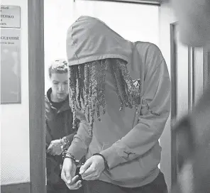  ?? ALEXANDER ZEMLIANICH­ENKO/ AP ?? WNBA star and two- time Olympic gold medalist Brittney Griner leaves a courtroom after a hearing in Russia on Friday.