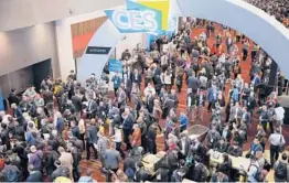  ?? JOHN LOCHER/AP ?? Crowds enter the convention center on the first day of the CES tech show in 2020 in Las Vegas. The 2022 CES gadget convention will be shortened by one day.