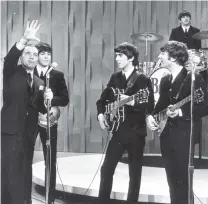  ?? PHOTO: ODT FILES ?? The Beatles made their first live American television appearance on The Ed Sullivan Show on this day in 1964. Ed Sullivan is pictured left.