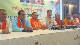  ?? HT PHOTO ?? Haryana BJP president Subhash Barala (centre) addressing the media in Karnal.