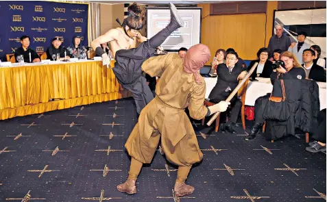  ??  ?? It was cameras at the ready for guests as the Japan Ninja Council staged a display of combat techniques as part of its drive to promote the ancient tradition