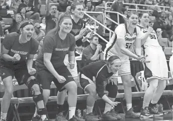  ?? ASSOCIATED PRESS ?? The UW-Green Bay bench erupts after a basket during the second half against Detroit in the Horizon League championsh­ip game Tuesday. The Phoenix beat the Titans, 64-52, to earn an NCAA Tournament bid.