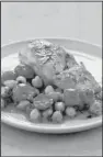  ?? Photo courtesy of America’s Test Kitchen ?? Baked Cod With Cherry Tomatoes and Chickpeas