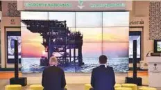  ?? AFP ?? People watch a visual display explaining different oil projects at the Saudi Arabian stand yesterday at the 22nd World Petroleum Congress in Istanbul.