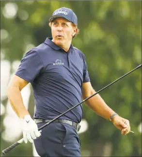  ?? Maddie Meyer / Getty Images ?? Phil Mickelson reacts to his drive on the 18th tee during the second round of the Travelers championsh­ip at TPC River Highlands in Cromwell on Friday.