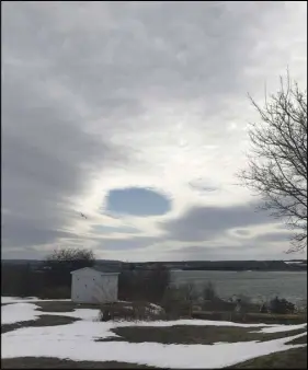  ??  ?? So glad that Heather Lewis was looking up on Saturday! This hole in the cloud appeared over Whitney Pier, NS...