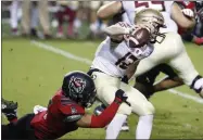  ?? ETHAN HYMAN - THE ASSOCIATED PRESS ?? North Carolina State linebacker C.J. Hart Jr. (5) sacks Florida State quarterbac­k Chubba Purdy (12) during the second half of an NCAA college football game Saturday,