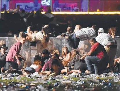  ??  ?? HORROR: People scramble for shelter after Stephen Paddock, 64, opened fire on country music fans in Las Vegas.