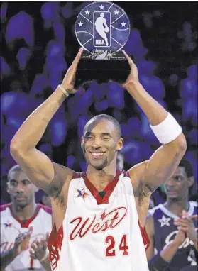  ?? REVIEW-JOURNAL FILE PHOTO ?? Kobe Bryant of the Los Angeles Lakers holds up the NBA All-Star Game Most Valuable Player trophy after scoring a game-high 31 points to go with five rebounds, six assists and six steals in the West’s 153-132 victory over the East on Feb. 18, 2007, at...