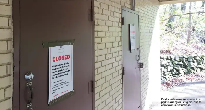  ??  ?? Public restrooms are closed in a park in Arlington, Virginia, due to coronaviru­s restrictio­ns.