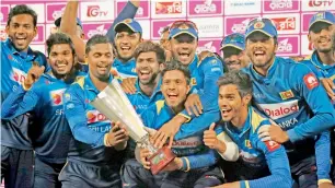  ?? AP ?? Sri Lanka’s players celebrate with the trophy after winning the final against Bangladesh in Dhaka. —