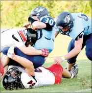  ?? RICK PECK/MCDONALD COUNTY PRESS ?? McDonald County’s Trey Black (64) takes the legs out from under Salem’s Quinci Leslie before Oakley Roessler finishes off the tackle from the top during the Mustangs’ 19-6 win on Aug. 18 at Salem High School.