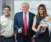  ??  ?? Thumbs up: The Trumps pose with the baby.