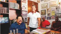  ?? AP ?? Mahinda Rajapaksa sits for photograph­s, with his lawmaker son Namal by his side, at his residence in Tangalle yesterday.