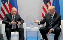  ?? PHOTO: REUTERS ?? Presidents Vladimir Putin and Donald Trump talk to the media after their official meeting at the G20 summit in Germany. Later that day they met informally for an hour at a leaders’ dinner.