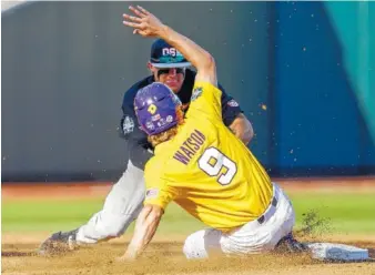  ?? THE ASSOCIATED PRESS ?? LSU’s Zach Watson is caught stealing second base by Oregon State shortstop Cadyn Grenier in the second inning of their NCAA College World Series game in Omaha, Neb., on Monday. Oregon State won 13-1.