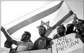  ?? TSAFRIR ABAYOV/AP ?? Asylum seekers protest in February in southern Israel. Thousands of African migrants say they’re fleeing danger.