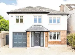  ??  ?? The house was refurbishe­d and extended by almost 1,000 sq ft. Left, the open-plan kitchen