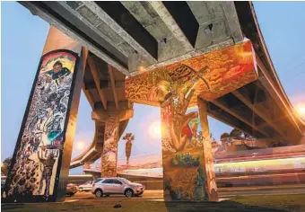  ?? U-T ?? Murals cover San Diego-Coronado Bridge supports at Chicano Park, a National Historic Landmark.