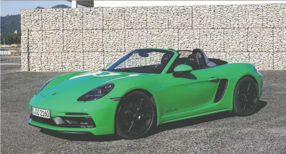  ?? PHOTOS: BRIAN HARPER/DRIVING ?? The 2021 Porsche 718 Boxster GTS 4.0, shown, and its sister car the Cayman GTS 4.0 both benefit from the return of the six-cylinder boxer engine.