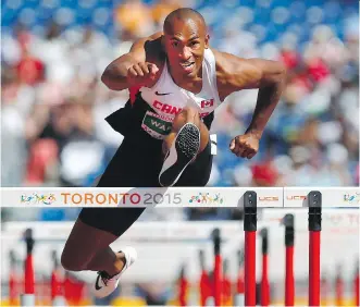  ?? MARK BLINCH/ THE CANADIAN PRESS ?? Damian Warner, of London, Ont., competes in the 110m hurdles, one of the events that make up the men’s decathlon at the 2015 Pan Am Games. Warner set a Canadian record in men’s decathlon and won the overall gold medal on Thursday in Toronto.