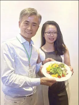  ??  ?? YesHealth iFarm president and chairman Winston Tsai displays a dish made from the company’s produce.