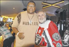  ?? Heidi Fang Las Vegas Review-Journal @HeidiFang ?? Lincoln Kennedy, left, and a fan in London, Keith Smith, before the Raiders’ 2019 game against the Bears.