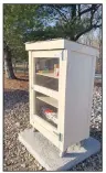  ?? (Courtesy Photo/Sally Carroll) ?? This free little food pantry box is usually stocked with various non-perishable food items for Bella Vista neighbors to take as they need. One donor stocked the pantry before the holidays with a frozen turkey and the fixings for a Christmas dinner.