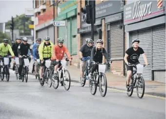  ??  ?? Cyclists raising money for Daft as a Brush, arrive back in Whitburn.