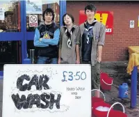  ??  ?? ●●Rochdale Pioneer Explorer Scouts carried out a carwash at Carcraft’s motorstore to raise money for an expedition.