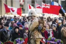  ?? BERNARD WEIL/TORONTO STAR ?? More than 1,000 people gathered at Queen’s Park for Remembranc­e Day.