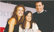  ?? RED PROUSER/REUTERS ?? John Travolta and his late wife Kelly Preston pose with their daughter Ella at the première of the film Old Dogs in 2009.