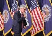  ?? (AFP) ?? US Fed chief Jerome Powell leaves after speaking at a news conference on Wednesday in Washington, DC