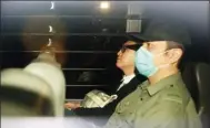  ?? PARKER ZHENG / CHINA DAILY ?? A correction­al services officer escorts localist politician Edward Leung Tin-kei (left) from the High Court in a prison van after he was found guilty on Friday of rioting in the 2016 Mong Kok riot.