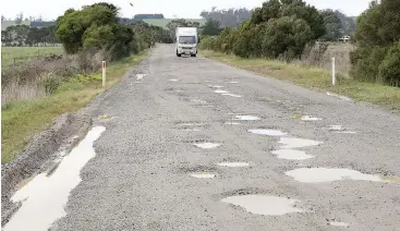  ??  ?? It’s pothole after pothole on several local roads at the moment.
Left: Potholes on Thornell Rd at Longwarry are impossible to miss by road users including this horse transport vehicle.
Below left: Rural mail deliverer Janis Otterspoor drives at a crawl along North Yannathan Rd at Modella, unable to avoid all the deep potholes up to 25 centimetre­s deep