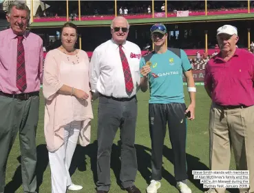  ??  ?? Steve Smith stands with members of Alan McGilvray’s family and the ABC’s Jim Maxwell during the Sydney Test, January 2018.