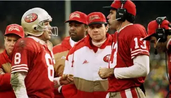  ?? Associated Press ?? Joe Montana (in jacket) engineered a trade when he lost his job to Steve Young (8).