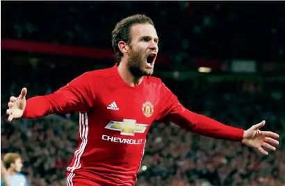  ?? Reuters ?? Juan Mata celebrates after scoring the winner for Manchester United against Manchester City on Wednesday night. —