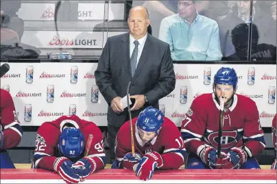  ?? CP PHOTO ?? Montreal Canadiens head coach Claude Julien and players Jonathan Drouin (92), Brendan Gallagher (11) and Alex Galchenyuk (27) look on from the bench during third period NHL hockey action against the Chicago Blackhawks, in Montreal on October 10, 2017....