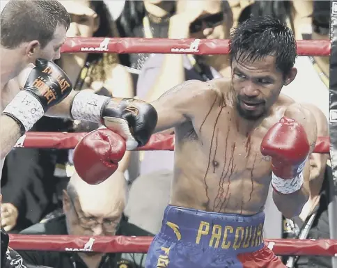  ?? PICTURE: TERTIUS PICKARD/AP ?? 0 A bloodied Manny Pacquiao, right, lost a unanimous points decision to local hero Jeff Horn.