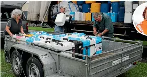  ?? CATHERINE GROENESTEI­N/STUFF ?? Dawn and Keith Benefield, who farm at Mangatoki, unload a load of chemical containers with truck driver Michael Watts (centre), during an Agrecovery collection at Stratford. Inset: Louise Campbell