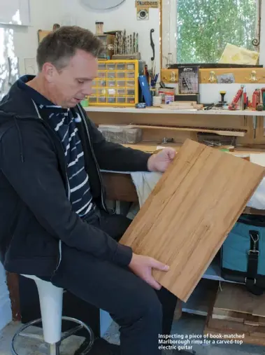  ??  ?? Inspecting a piece of book-matched Marlboroug­h rimu for a carved-top electric guitar