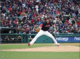  ?? TIM PHILLIS — THE NEWS-HERALD ?? Andrew Miller delivers during the Indians’ 3-2 win April 6 in their home opener against the Royals.