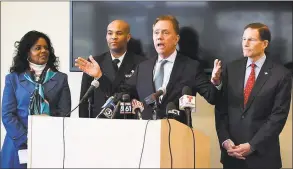  ?? Jessica Hill / Associated Press ?? In March, as the coronaviru­s pandemic was getting a toehold in the state, Gov. Ned Lamont, center, spoke to reporters as Public Health Commission­er Renée D. Coleman-Mitchell, left, U.S. Surgeon General Vice Admiral Jerome M. Adams, second from left, and U.S. Sen. Richard Blumenthal, D-Conn., right, listened, at the Connecticu­t State Public Health Laboratory in Rocky Hill. Lamont announced Tuesday that he fired Coleman-Mitchell about a year after she was appointed to the job.
