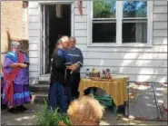  ?? NICHOLAS BUONANNO — NBUONANNO@TROYRECORD.COM ?? Three Native Americans are seen preparing for the blessing of Veterans Victory Garden in 1st Street in Troy Wednesday afternoon.