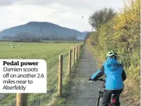  ??  ?? Pedal power Damien scoots off on another 2.6 miles near to Aberfeldy