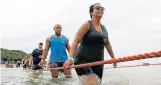  ??  ?? THE WET LOOK: The runners took to the water with great enthusiasm with a little help along the way at Surfers