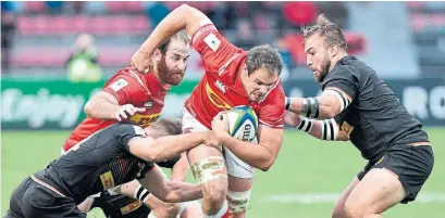  ?? GERARD JULIEN AFP/GETTY IMAGES ?? Canadian captain Phil Mack, centre, pushes ahead during Canada’s win on Saturday at the last-chance Rugby World Cup qualifier.