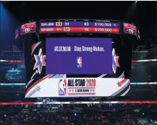  ?? NBAE VIA GETTY IMAGES ?? A message to show support for China’s fight against COVID-19 appeared on the jumbotron at the 2020 NBA All-Star Game in Chicago, Illinois.